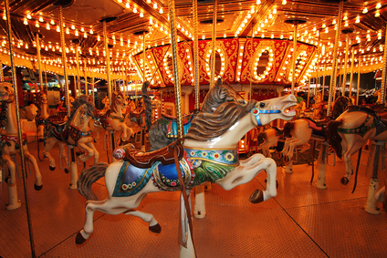 Beautifully decorated carousal horses on a merry-go-round