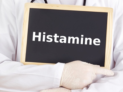 doctor holding chalkboard that says histamine