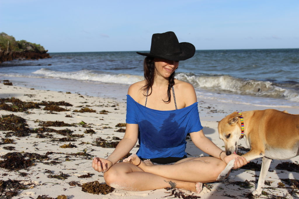 yasmina ykelenstam meditating on the beach in kenya