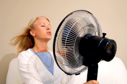 woman in front of fan