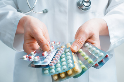 doctor holding pill packets