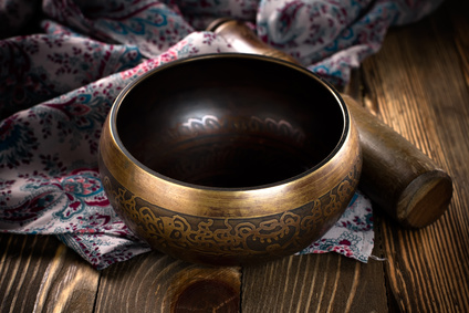 Singing bowl on prayer shawl