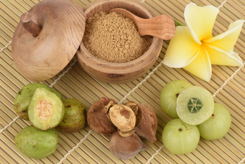 triphala ingredients on a bamboo background