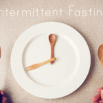 white plate with spoon and fork, Intermittent fasting concept, ketogenic diet, weight loss